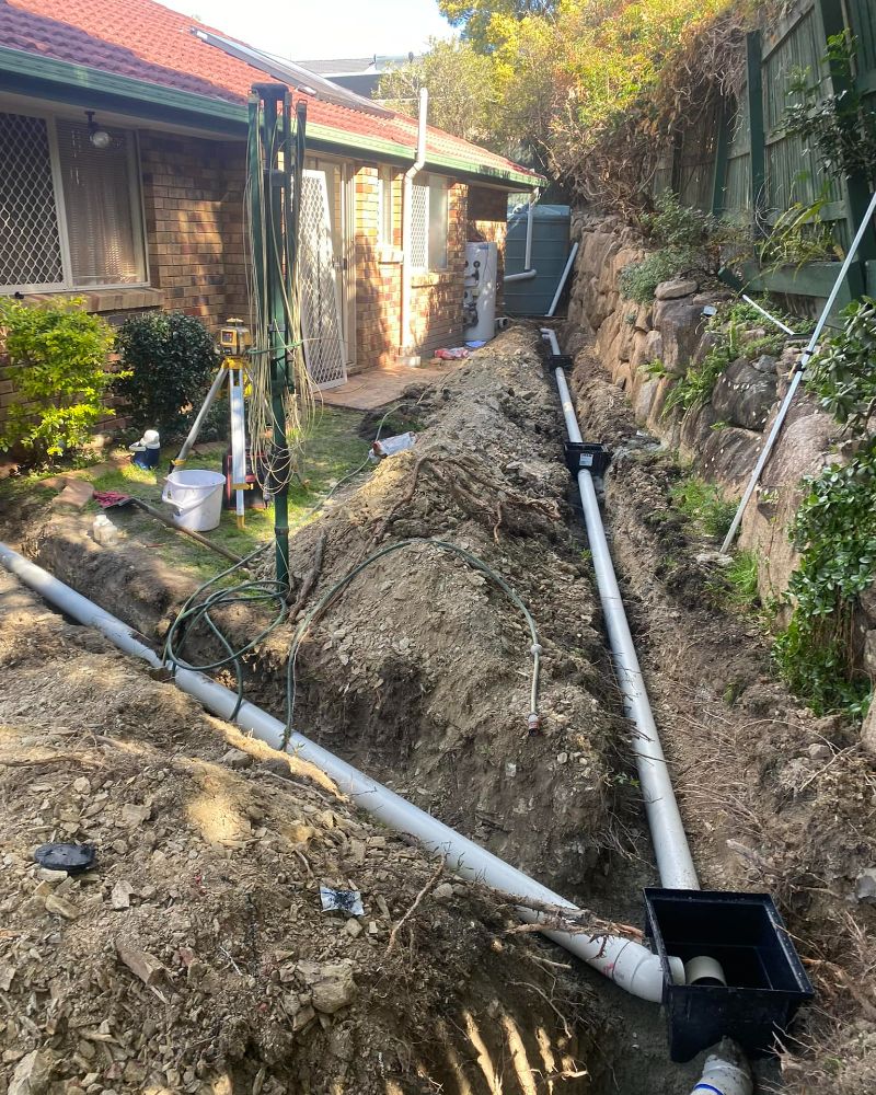 repairing a back yards drain blockage